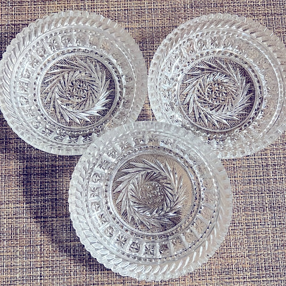 Beautiful crystal shallow bowls, pinwheel star pattern and sawtooth rim!